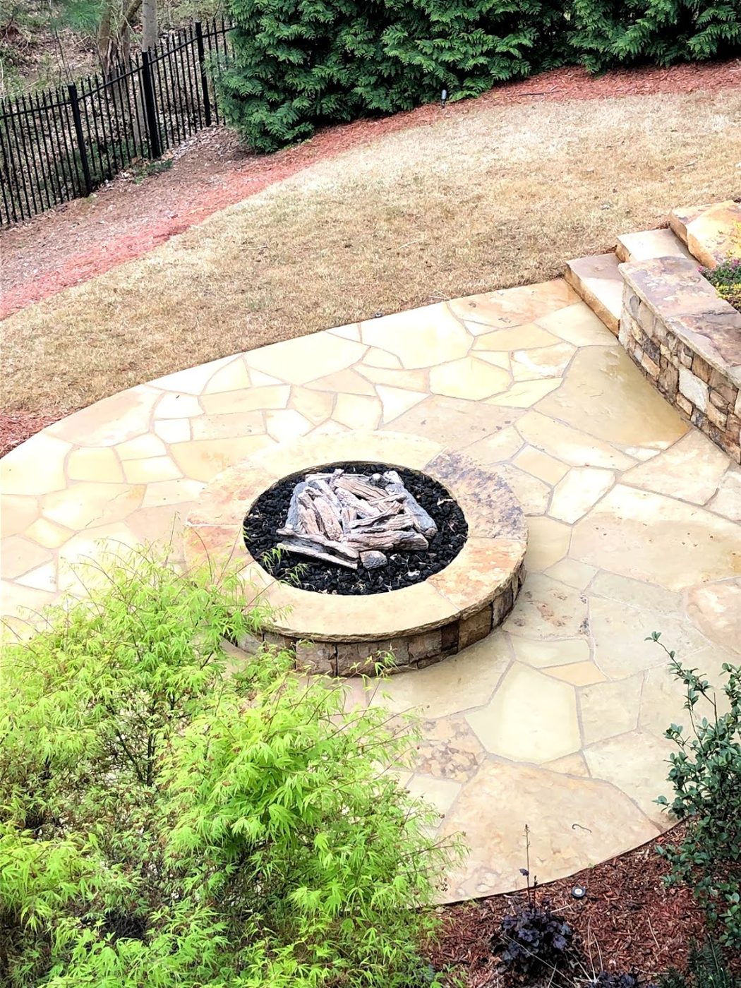 Pressure-washed flagstone patio and fire pit